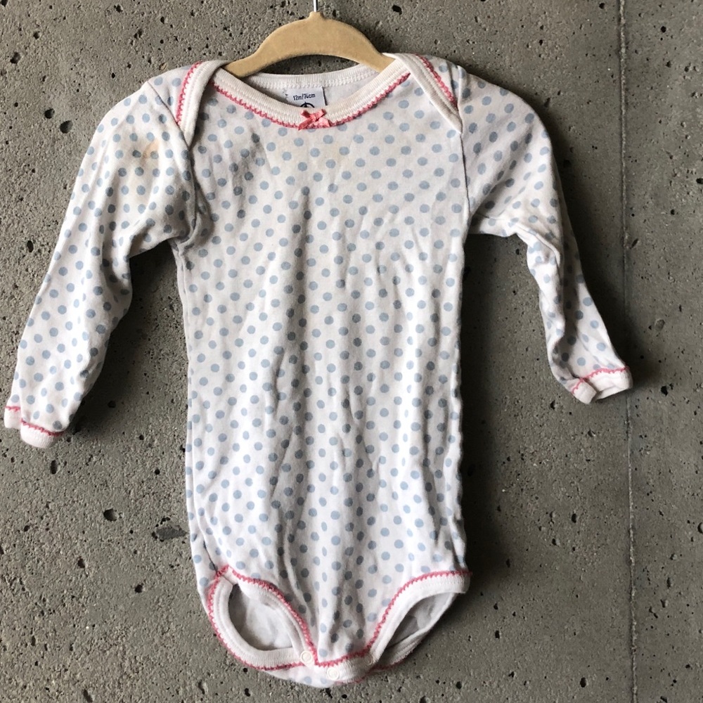 White onesie with blue dots